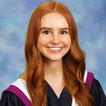 smiling graduating redhead student