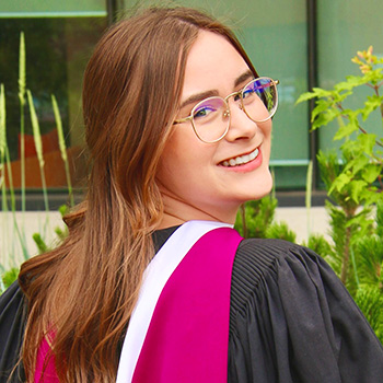 graduating student looking over shoulder