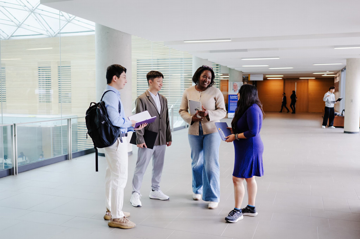 Lazaridis MMA students catching up in Lazaridis Hall
