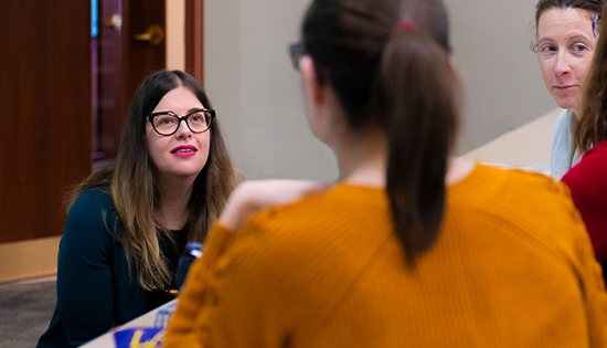 students talking with professor